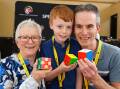 Shirley Lewis, Daniel Lewis, 10, and Michael Lewis at a speed cubing event in Ballarat. Picture by Kate Healy
