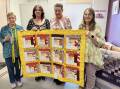 West Australian Volunteers (LtoR) Mary, Dizzy, Dihane and Bronwyn with one of their quilts. Picture supplied.
