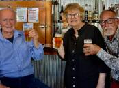 Clunes locals Richard Gilbert, Tess Brady, Hugh Wayland toast their new book A Thirst for Gold, which launches as part of Clunes Booktown Festival this weekend. Picture supplied