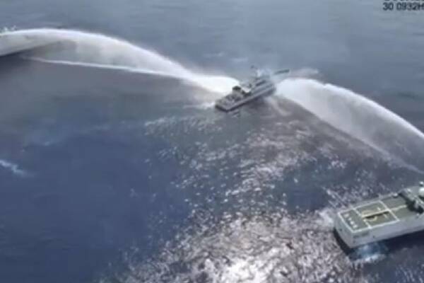 China's use of water cannons against two vessels from the Philippines has sparked outrage. (AP PHOTO)