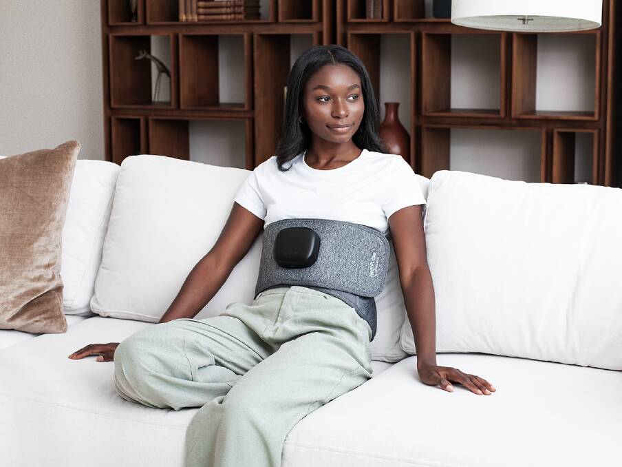 A woman models Hydragun's HeatPulse Back & Core massager. Picture supplied