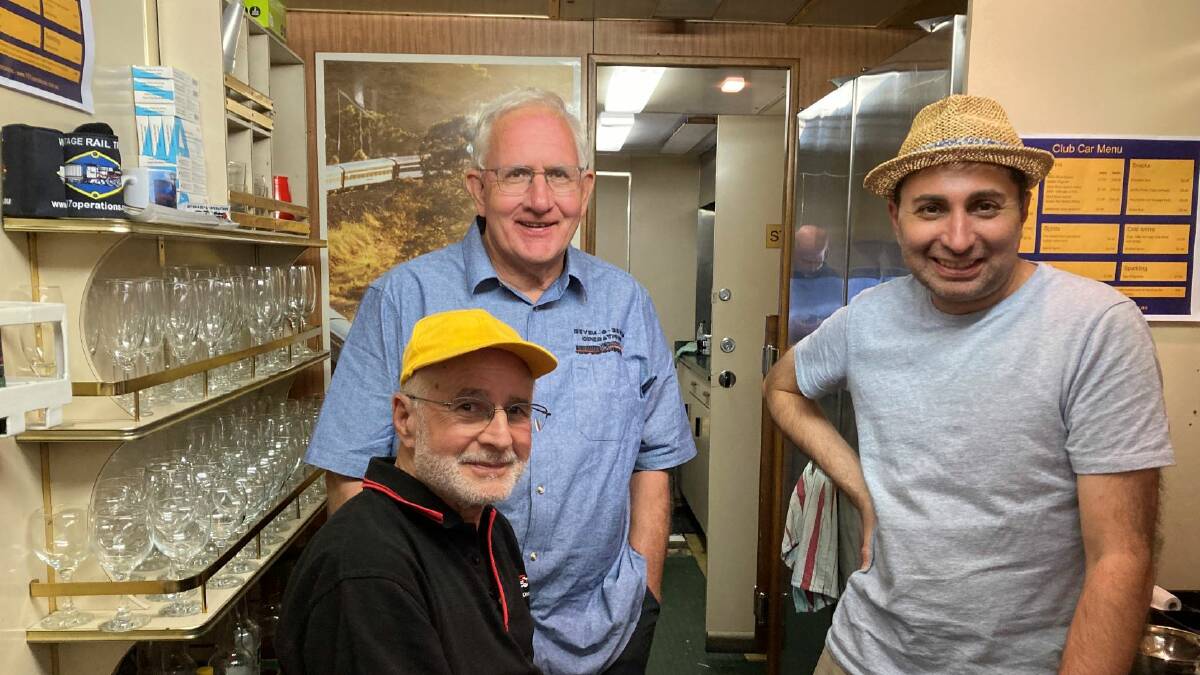 Volunteers Natale Palmiere, Steve Agnew and Vincent Nativo keep people refreshed in the trains Club lounge. Photo Sue Preston.