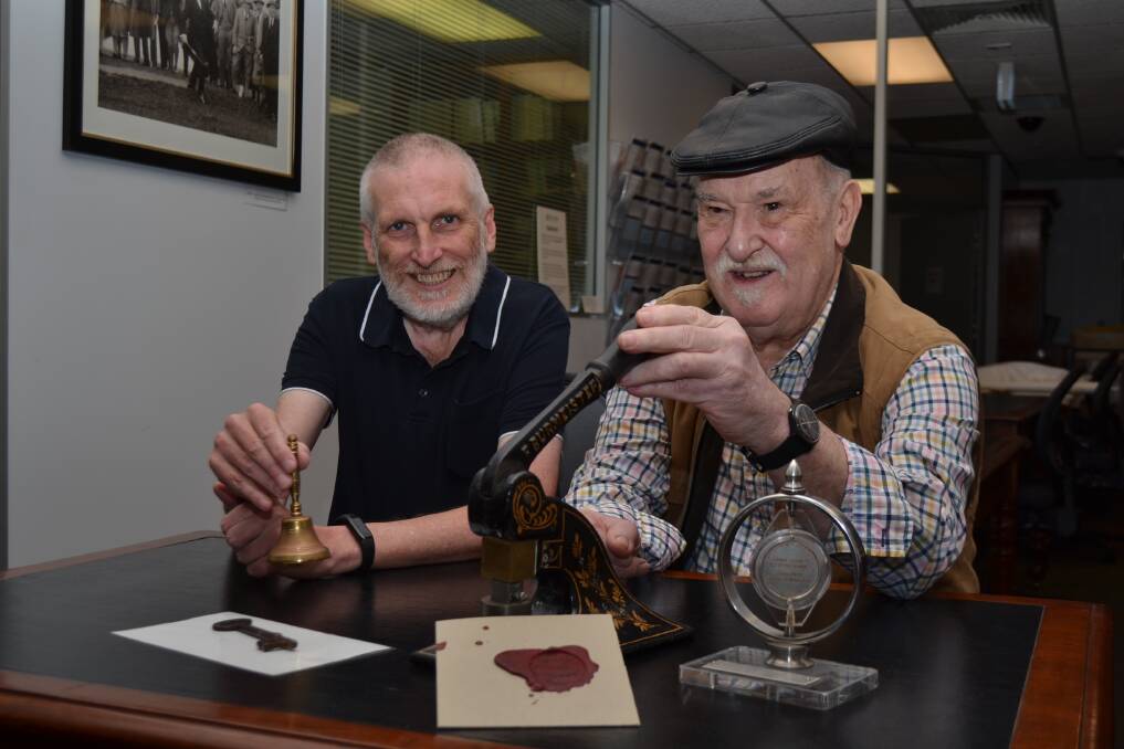 City of Adelaide Archives team leader Michial Farrow and council volunteer Graeme Lange with objects from the North Adelaide Institute. Picture by Anthony Caggiano