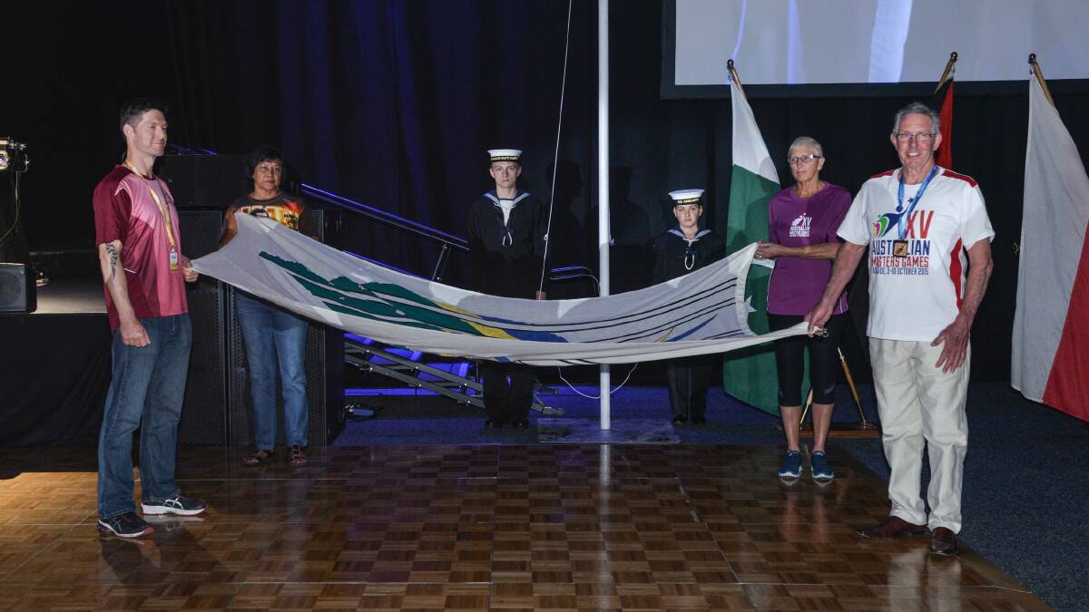 Rodney Biggs (far right) as a flag bearer at the 2015 Australian Masters Games. Picture supplied