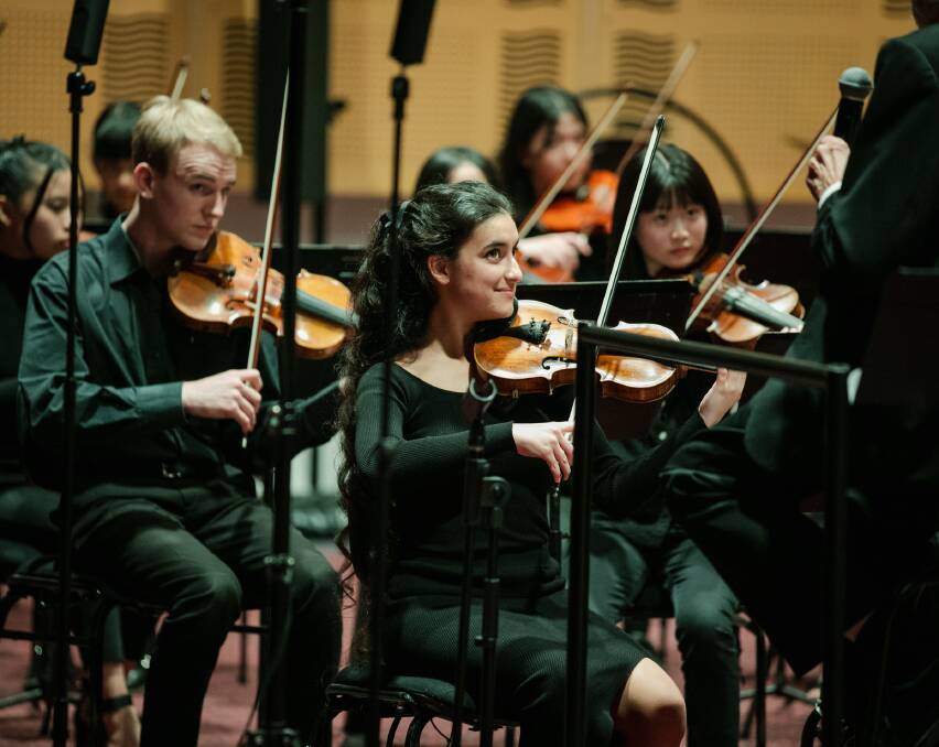 Members of the Adelaide Youth Orchestra playing violins. Picture supplied