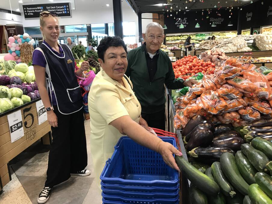Magda and Roberto De Loaiza go shopping for groceries with their carer Molly. Picture supplied