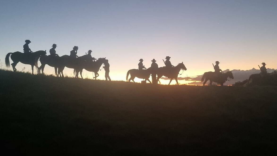 Light Horse troopers descending the mountain at sunset. Picture: Francine Rigby