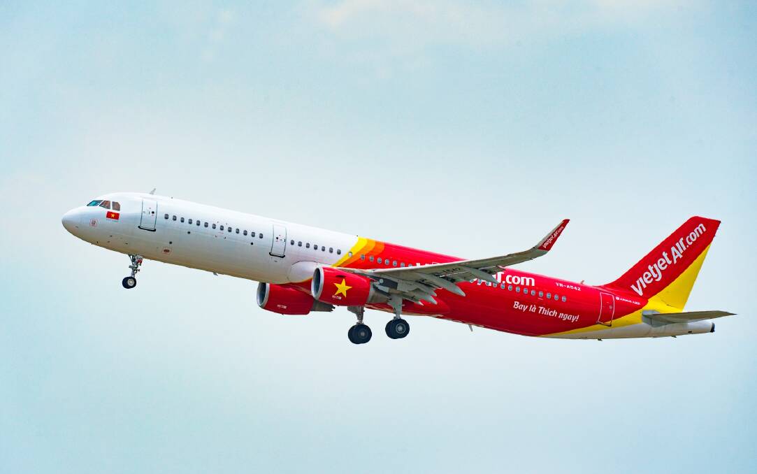 A VietJet Air aeroplane flying in a light blue sky. Picture from VietJet Air.