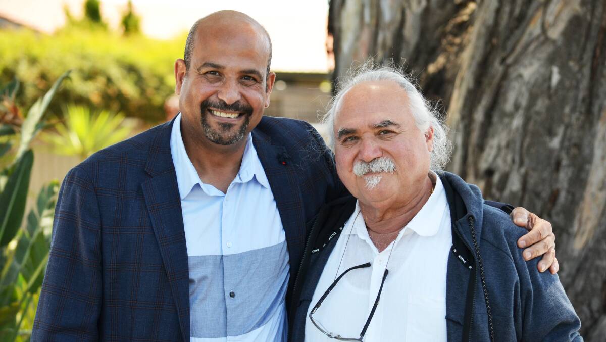Australian Refugee Association's Mohsen Abdel-Meseh and Zimala project participant John Simon, in December. Picture by Anthony Caggiano