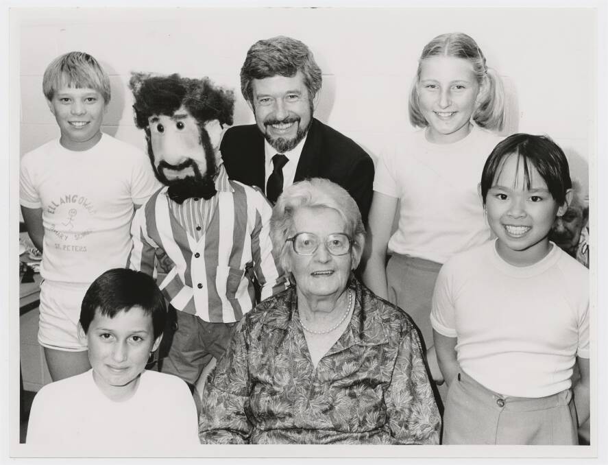 Keith Conlon with his Keith Conlon puppet made by (left to right top) Michael Sassano of Newton; Keith; Lee-Anne Smith. (Bottom row left to right) Marty Hardy, Marden and Mrs Ellen Westover, St Peters, who made the fantastic striped blazer and young Yeti Cliff of Hackney, 1985. Picture SLSA B 7086914012/Messenger Press