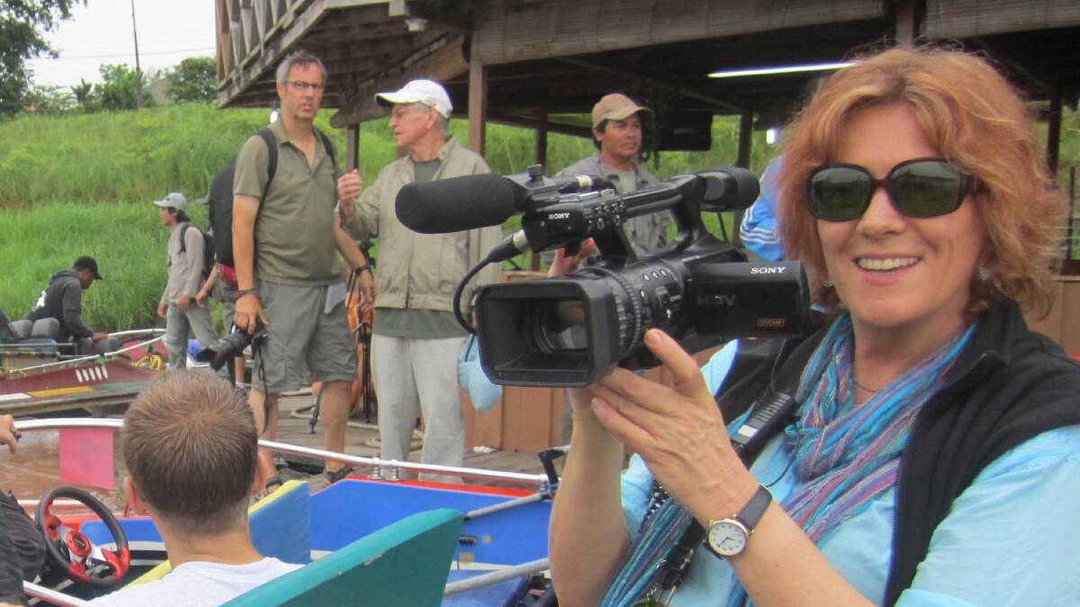 Cathy Henkel filming a documentary in Borneo. Picture supplied