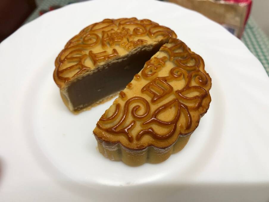A white lotus seed mooncake cut in half. Picture by Anthony Caggiano