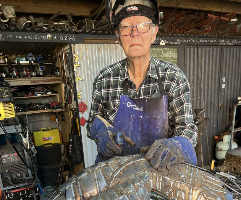 Long Beach, NSW, sculptor Paul Dimmer at work on another of his distinctive works. Picture supplied
