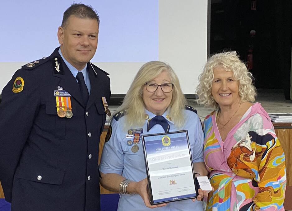 Ulladulla SES Unit Commander Tracy Provest receives her long service award from NSW SES Deputy Commissioner Daniel Austin and State Member for South Coast Liza Butler. Picture by Glenn Ellard.
