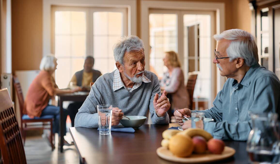 Two men talking. Picture by Shutterstock