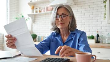 Generic image of woman looking at finances. Picture from Shutterstock