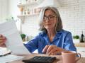 Generic image of woman looking at finances. Picture from Shutterstock