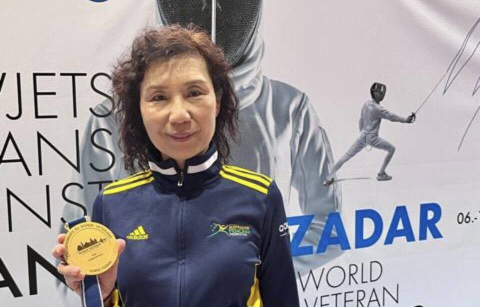 Min Yi Du with her gold medal at last year's World Veteran Championships. Picture supplied