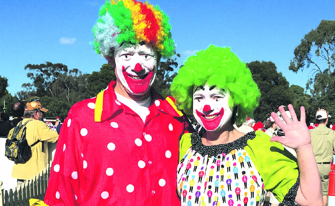 HOW MANY? Geoff Hallion with his niece and fellow counting clown Louise get ready to count the crowds at last year’s Adelaide Credit Union Christmas Pageant.
