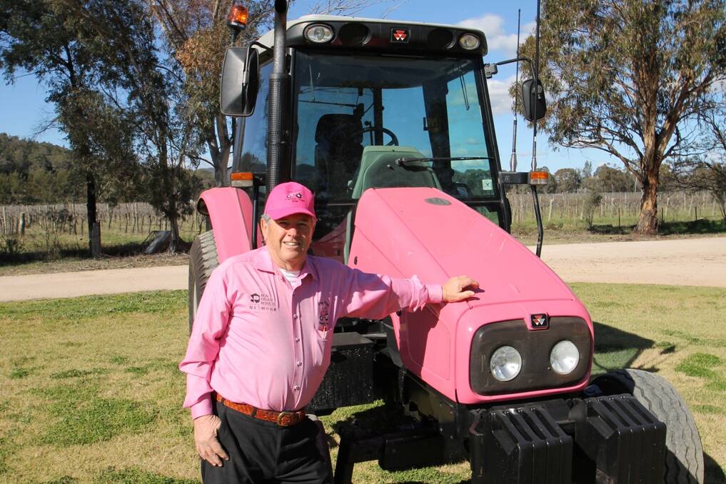 IN THE PINK – Hugh Bateman and his pink tractor will travel around the state to help the McGrath Foundation.