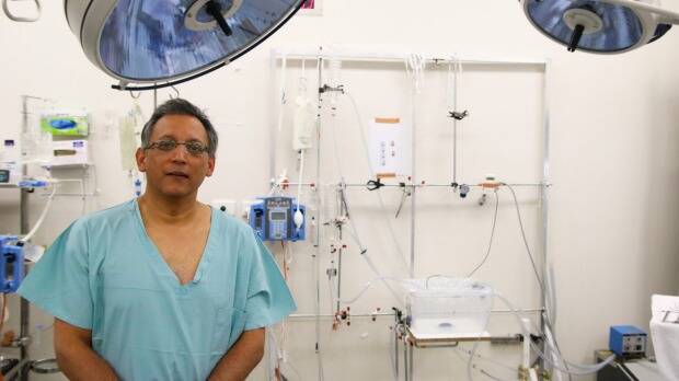 Associate Professor Kumud Dhital from the Victor Chang Cardiac Research Institute with the purpose-built liver transplant machine. Photo: supplied
