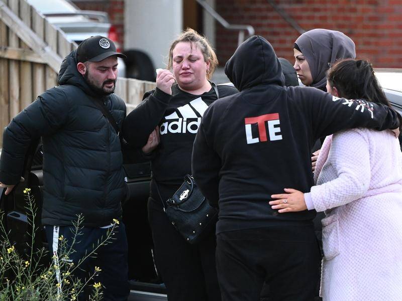 Mourners have gathered at the northern Melbourne home where four bodies were found. (Joel Carrett/AAP PHOTOS)