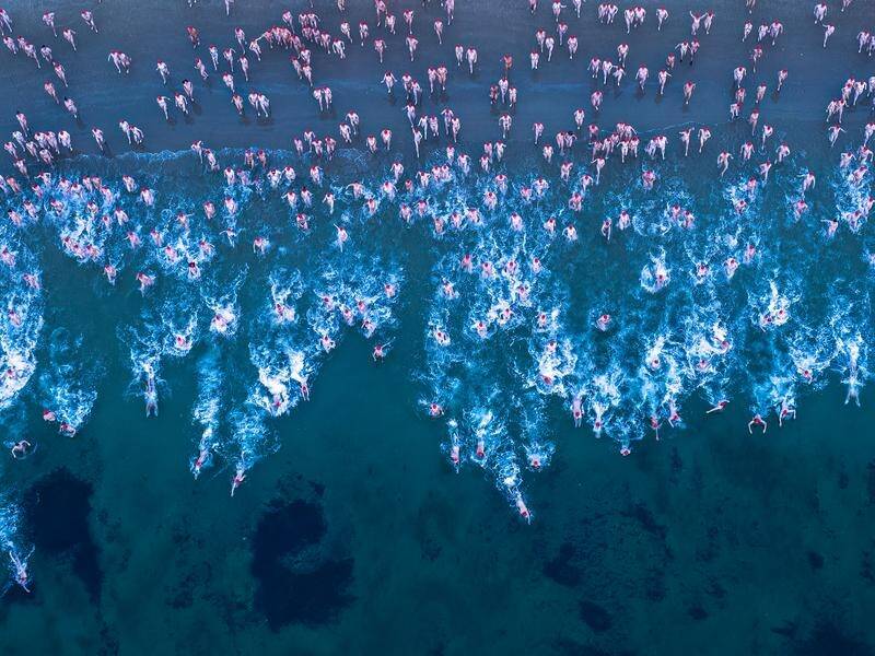Dark Mofo's nude solstice swim will return with its largest-ever capacity of 3000 people. (Rob Blakers/AAP PHOTOS)