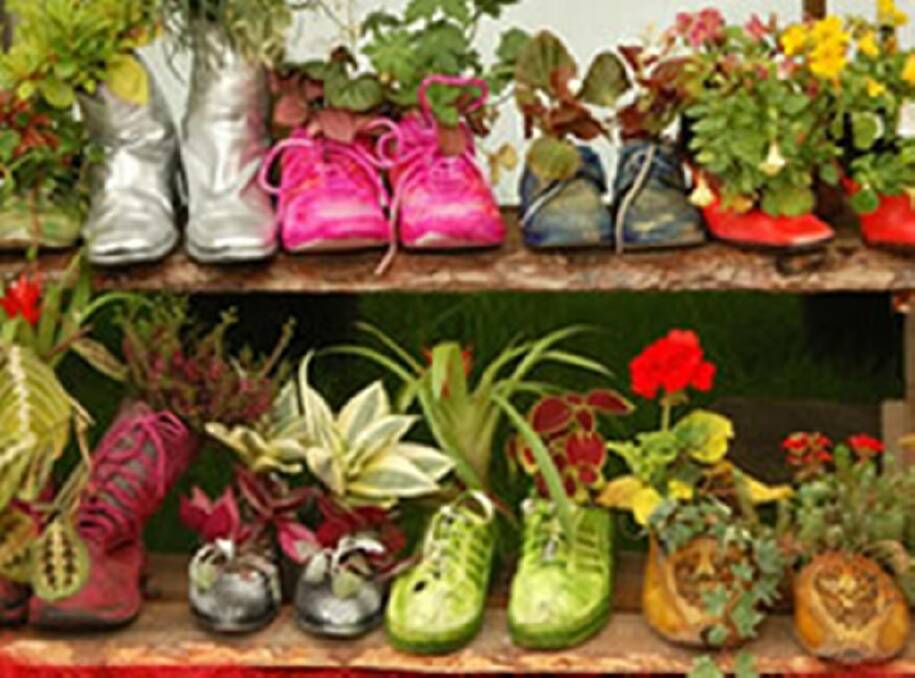 Make a floral display of your old boots and shoes.