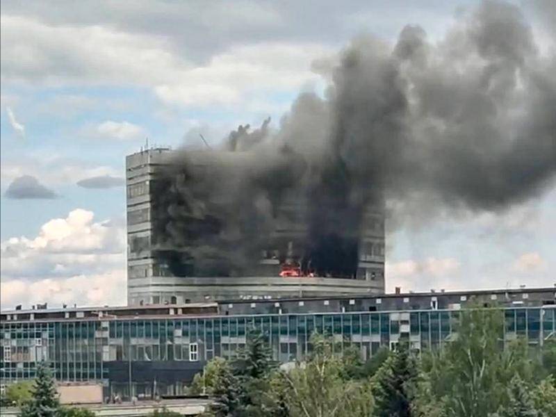 Eight people have died in a fire near Moscow in a building used by a company sanctioned by the US. (AP PHOTO)